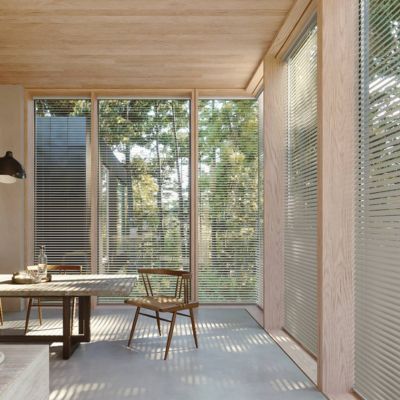 minimalist blinds in a dining room corner window